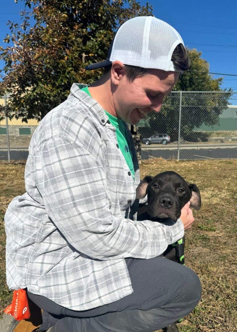 Volunteer with puppy
